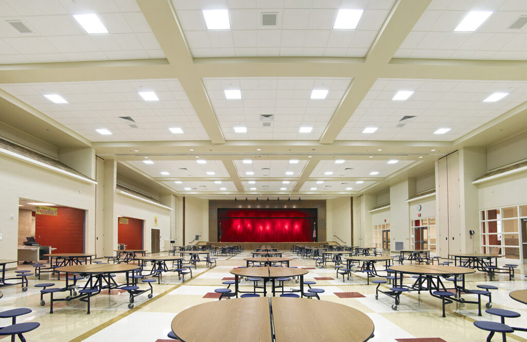 elementary school cafetorium with tables and stage