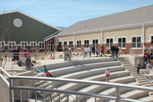students playing on school amphitheater